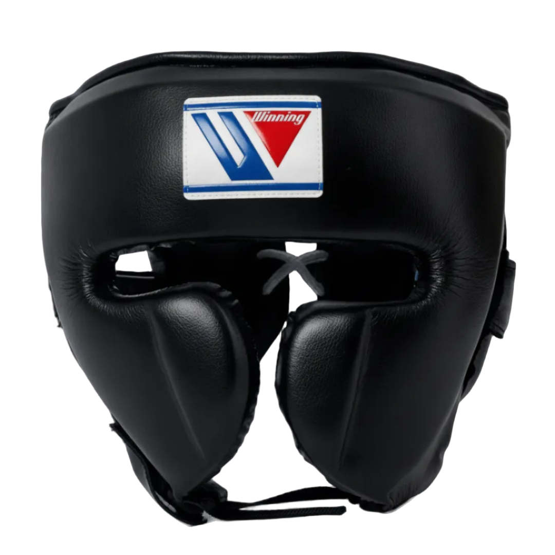 Black leather boxing headgear with a white, blue, and red Winning brand patch on the forehead, shown against a dark blue gradient background.