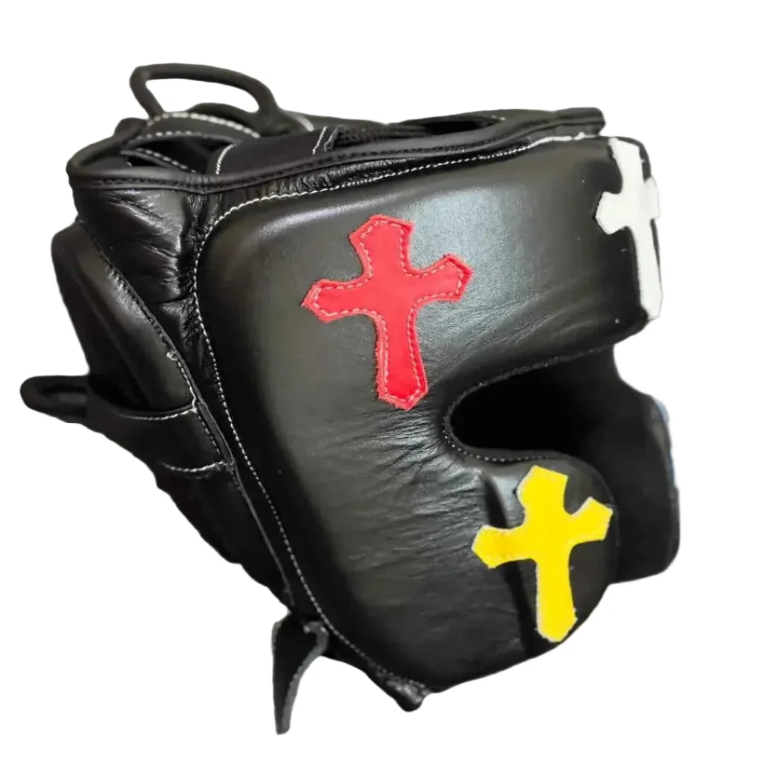 Black boxing glove with colorful crosses on a dark background