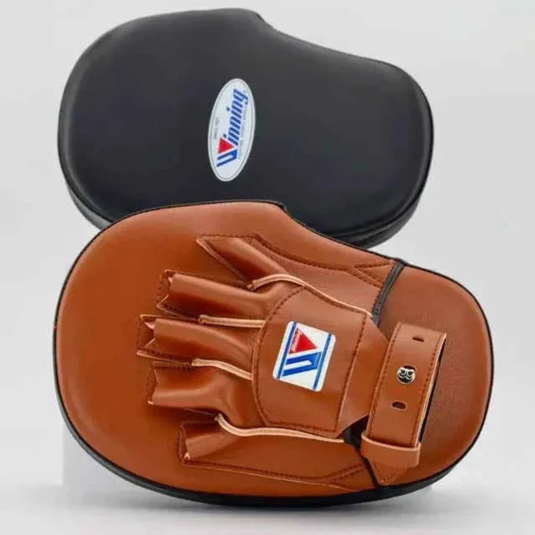 Brown and black boxing mitts with a brand logo on a light gray background